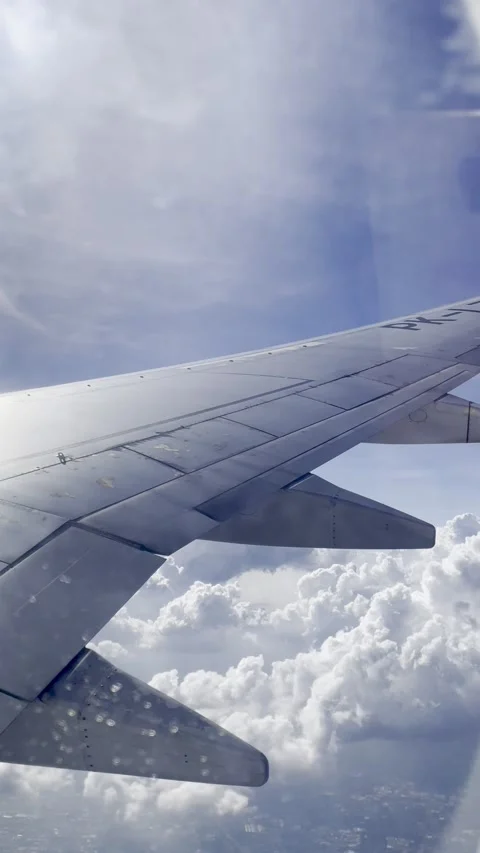 Airplane wing and clouds Stock Footage 283816557