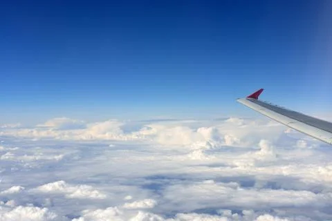 Airplane wing and clouds Stock Photos