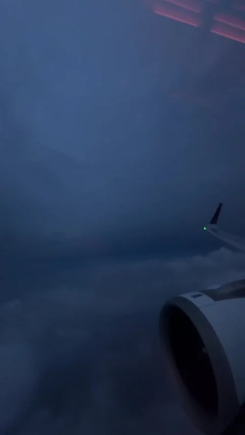 Airplane Wing and Engine Above Clouds at Twilight Stock Footage 341317674