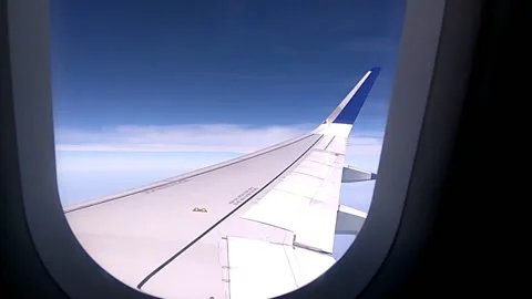 Airplane wing and sky Stock-Footage 154307804