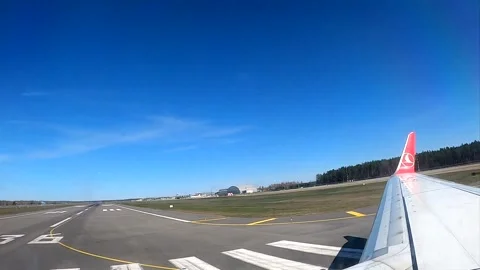 Airplane wing and tail view taxiing on the runway for takeoff Stock Footage 337056877