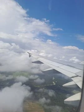 Airplane wing beyond the cloud Stock Photos