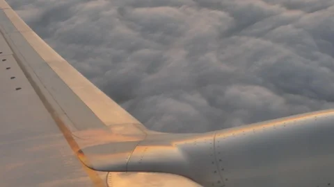 Airplane wing closeup at the cloudy sky Stock Footage 115111976