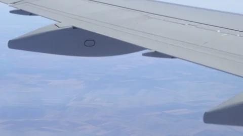 Airplane wing on a cloud background. Bird's-eye Stock Footage 101388744