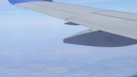 Airplane wing on a cloud background. Bird's-eye Stockbeeldmateriaal 101388916