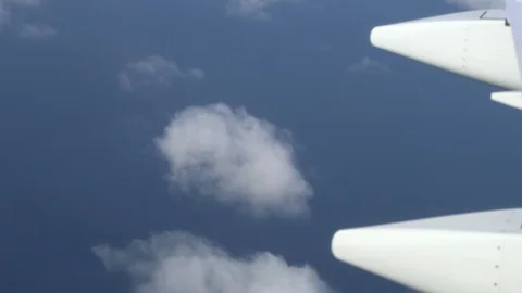 Airplane wing on a cloud background. Bird's-eye Stockbeeldmateriaal 101389331