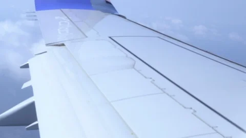 Airplane wing on a cloud background. Bird's-eye Stockbeeldmateriaal 101391326