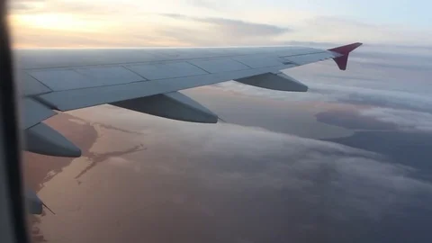Airplane Wing, Clouds and the Sunset Video stock 82276359