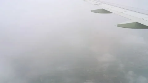 Airplane wing in the clouds Stock Footage 176484048
