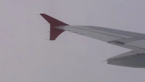 Airplane wing in the clouds, moving forward, flying Stock Footage 246125085