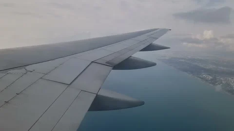 Airplane wing in the clouds. View from the porthole Stock Footage 285017281