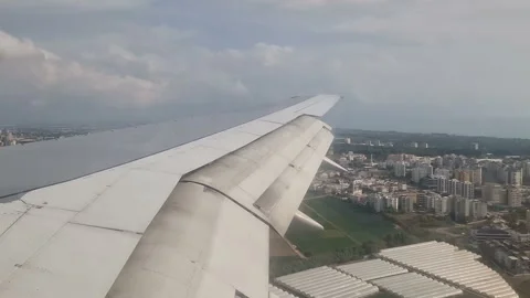 Airplane wing in the clouds. View from the porthole Stock Footage 285621165