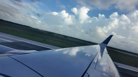 Airplane Wing with Cloudscape and Sunset Horizon View Stock Footage 312747063