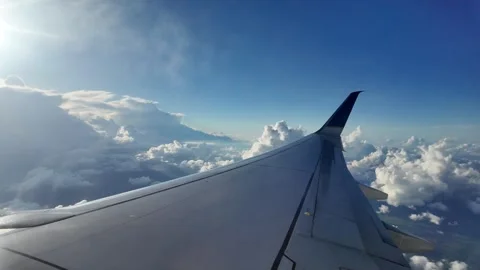 Airplane Wing with Cloudscape and Sunset Horizon View Stock Footage 312752442