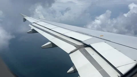 Airplane Wing During Flight Through Clouds in Macau 스톡 동영상 252340829