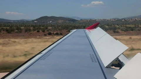 Airplane wing during landing Stock Footage 126889306