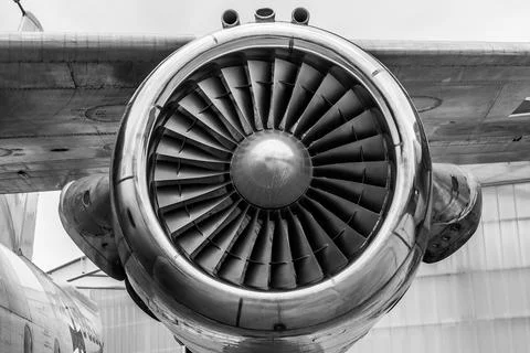 Airplane wing with engine, view under the plane during flight service Stock Photos