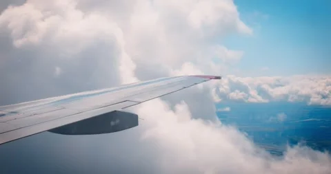 Airplane wing enters cloud, view from window. journey into the sky. airplane Stock Footage 263197880