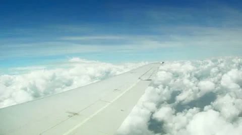 Airplane Wing in Flight Above the Clouds Video stock 24708030