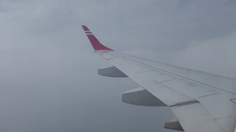 Airplane wing flight in clouds Stock Footage 104217725