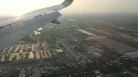 Airplane wing in flight, sunset Stock Footage 307574891