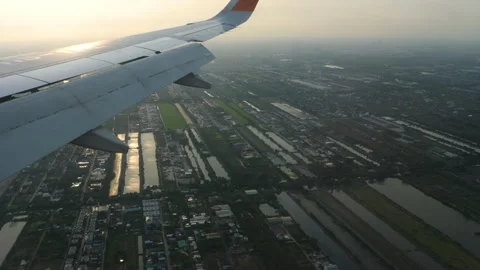Airplane wing in flight, sunset Stock Footage 311131292