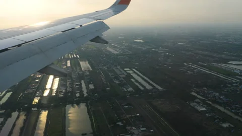 Airplane wing in flight, sunset Stock Footage 314229174