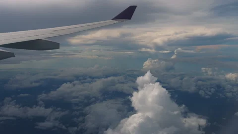 Airplane wing flying above the clouds Stock Footage 301393955