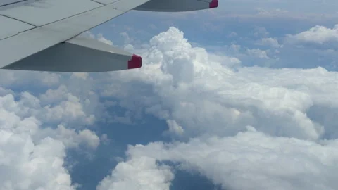 Airplane Wing Flying Above the Clouds Stock Footage 304611597