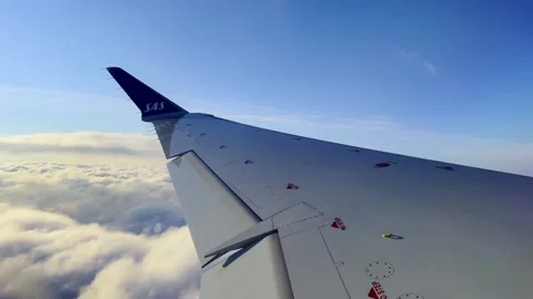 Airplane wing flying in clear blue sky for travel concept Видео 280850132