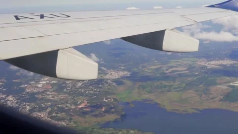 Airplane Wing Flying Over Landscape View From Window Video stock 277468191