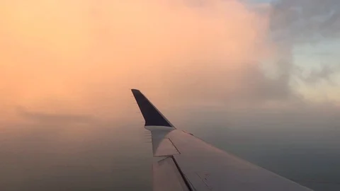 Airplane wing flying through clouds. Stock Footage 97754842
