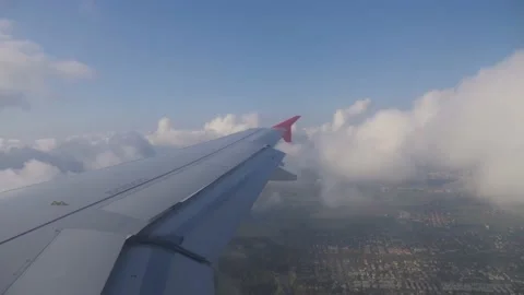 Airplane wing flying through the clouds Stock Footage 199118134