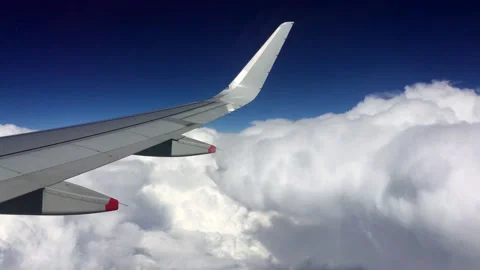 Airplane Wing Flying Through Clouds from Airbus Cabin Window Stock Footage 313227360