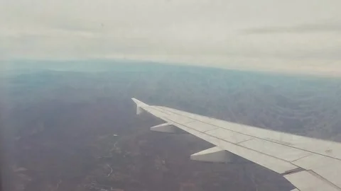 Airplane Wing Flying Window View Inside Stock Footage 339978571