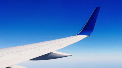 Airplane Wing Isolated Against Clear Blue Sky Stock Footage 346650345