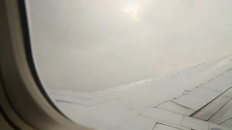 Airplane wing as it's flying Stock Footage 33749632