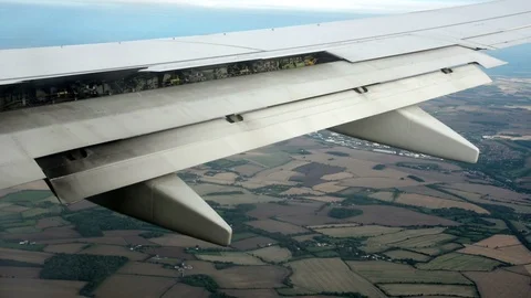 Airplane wing before landing Stock Footage 98553379