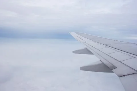 Airplane wing out of window Stock Photos