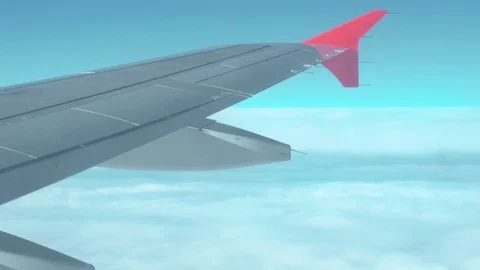 An airplane wing over the clouds 動画素材 84066403