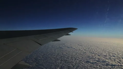 Airplane wing over the clouds Stock Footage 143349638