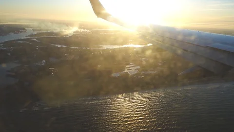 Airplane wing over the seashore Stock Footage 124491194