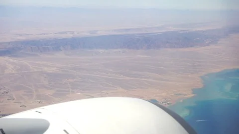 Airplane Wing from passenger window Stock Footage 74950153