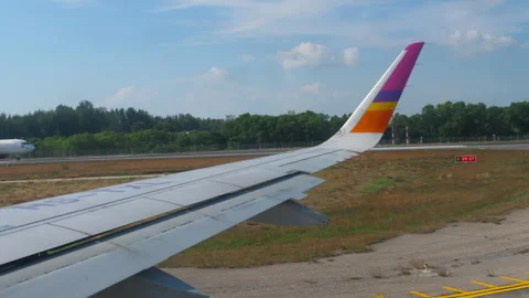 Airplane wing seen through window Stock Footage 311131167