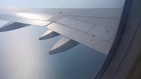 Airplane wing. shoot behind window. Stock Footage 275158450