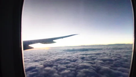 Airplane Wing Silhouette Over Cloud Sea at Golden Sunset Vídeo Stock 335769357