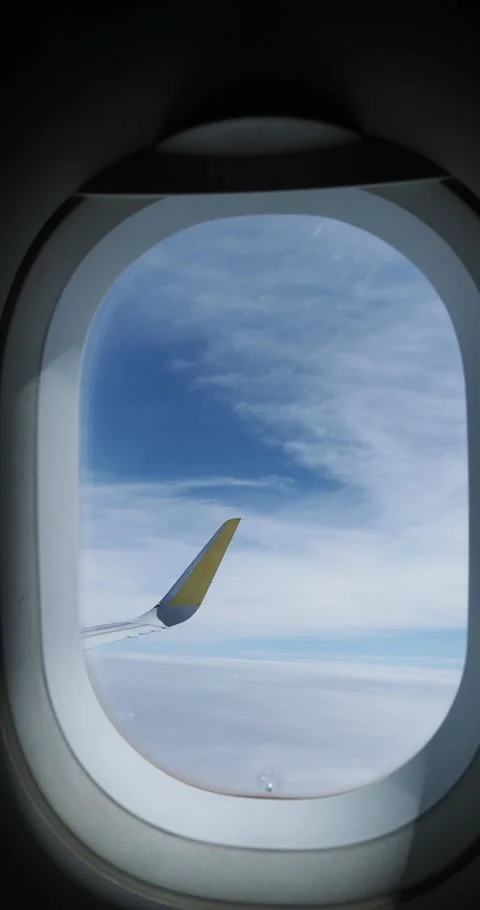 Airplane wing soaring gracefully above a sea of clouds 스톡 동영상 300618762
