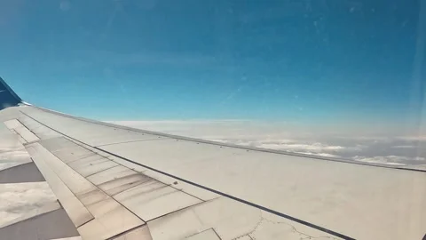 Airplane Wing Soaring In The Sky And Spectacular View Of Clouds Stock Footage 339978703