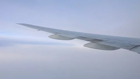 Airplane wing soaring through the sky Video stock 301380186