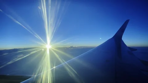 Airplane Wing with Sun Rays - 4K Aerial View from Window Stock Footage 340131655